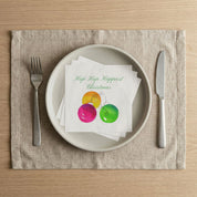 Hap Hap Happiest Christmas napkin on a dinner plate for a holiday party