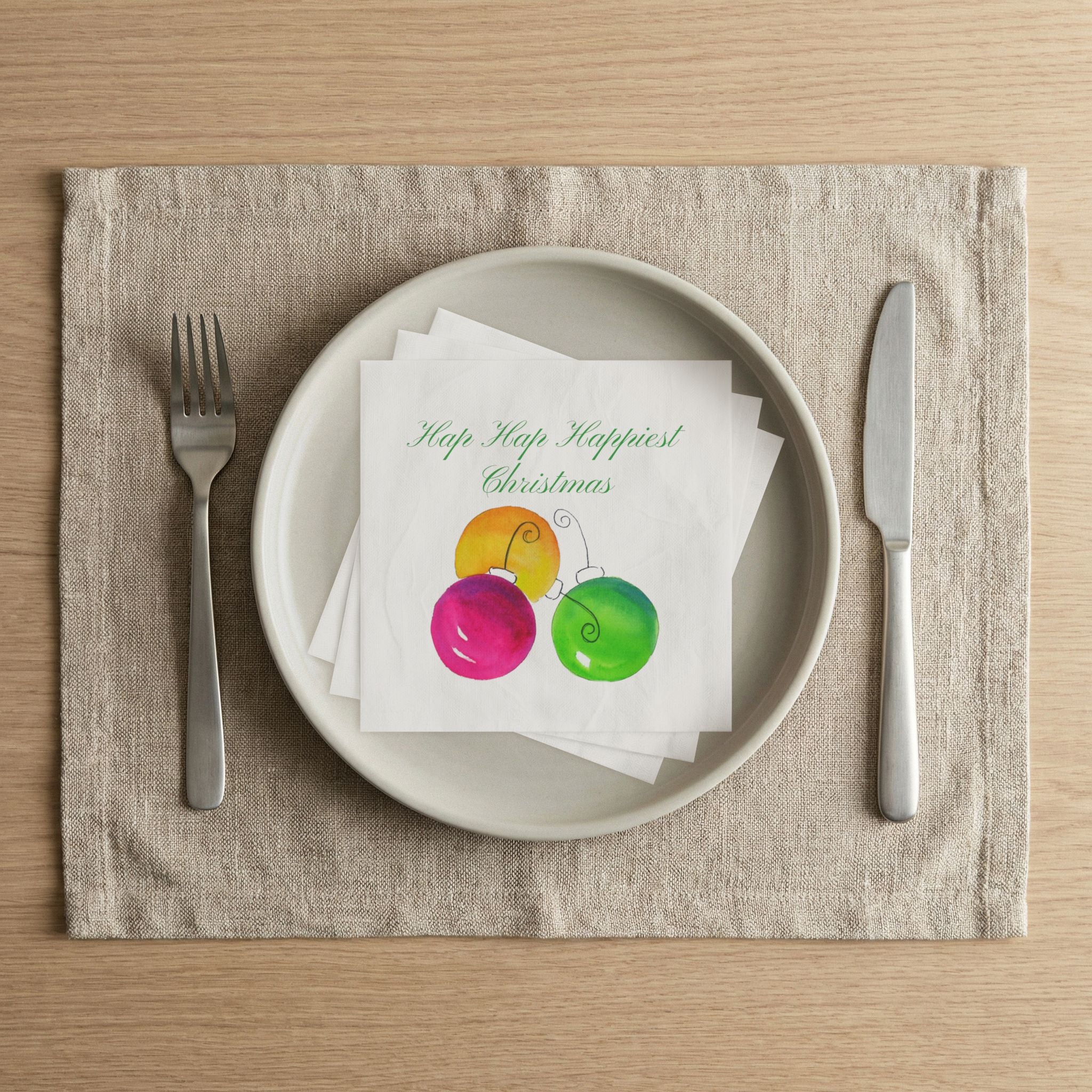Hap Hap Happiest Christmas napkin on a dinner plate for a holiday party