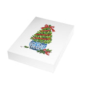 Boxwood Christmas topiary with red ribbon in blue and white chinoiserie pot Christmas card pack, stack of 5x7 folded cards