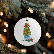 Boxwood topiary watercolor ornament hanging on a lit Christmas tree
