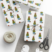Christmas topiary wrapping paper with watercolor boxwood trees in blue and white chinoiserie pots by Laura Trevey, gifts wrapped with string and gift tags