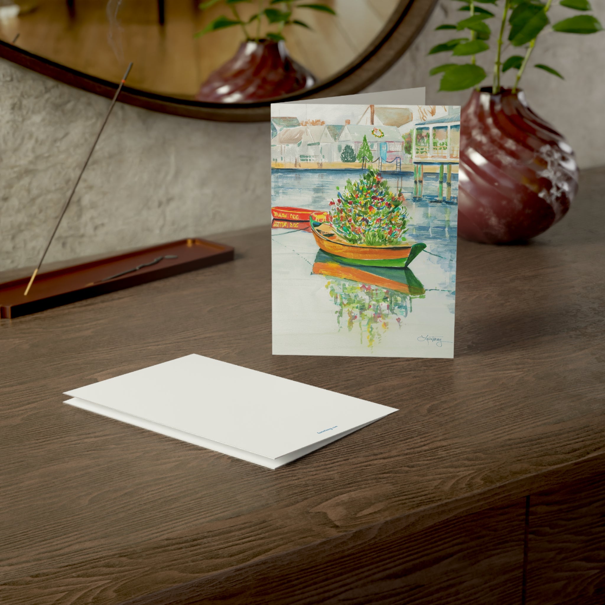 Christmas on Nantucket watercolor greeting card, on a wooden dresser with envelope