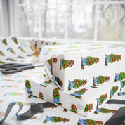 Christmas topiary wrapping paper with watercolor boxwood trees in blue and white chinoiserie pots by Laura Trevey, gift wrap in a holiday wrapping scene
