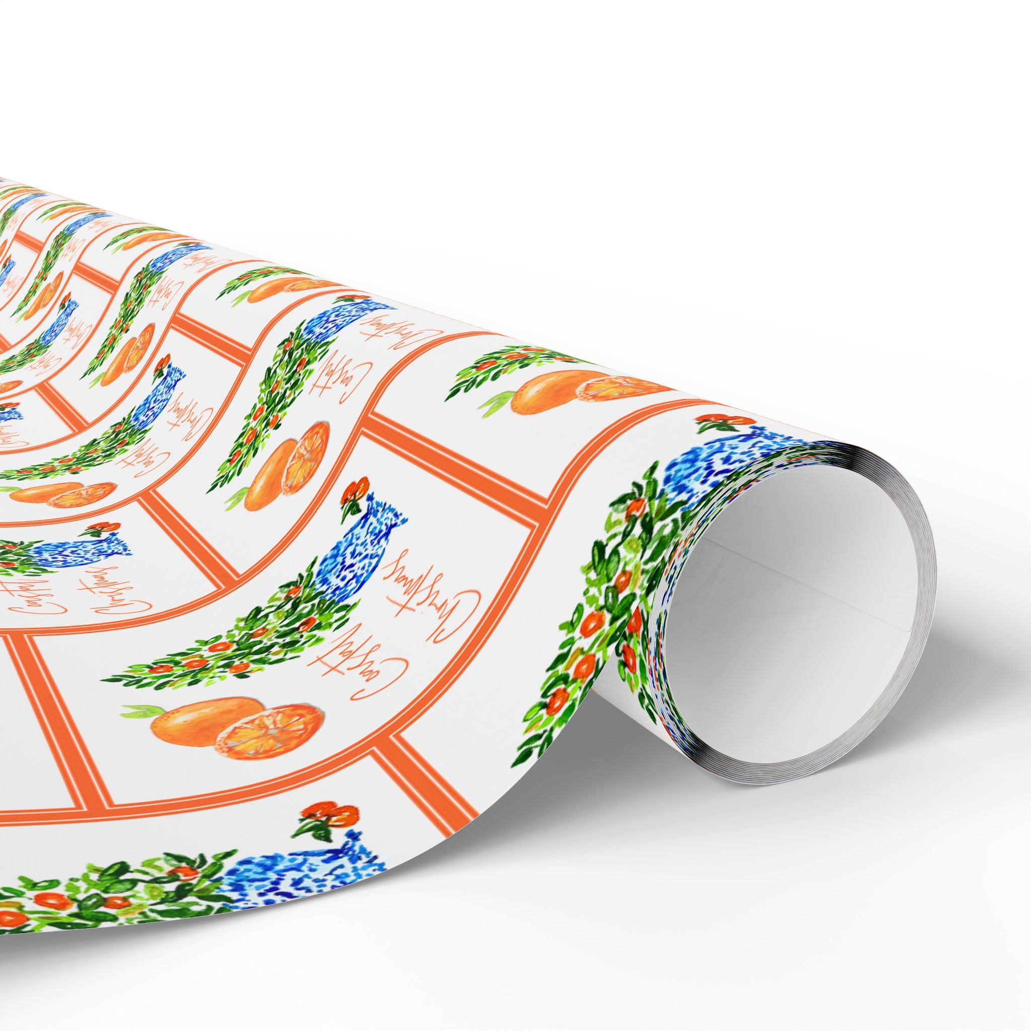 Citrus orange tree wrapping paper with watercolor orange trees in blue and white chinoiserie pots and Coastal Christmas script by Laura Trevey, roll unrolled to show the design up close