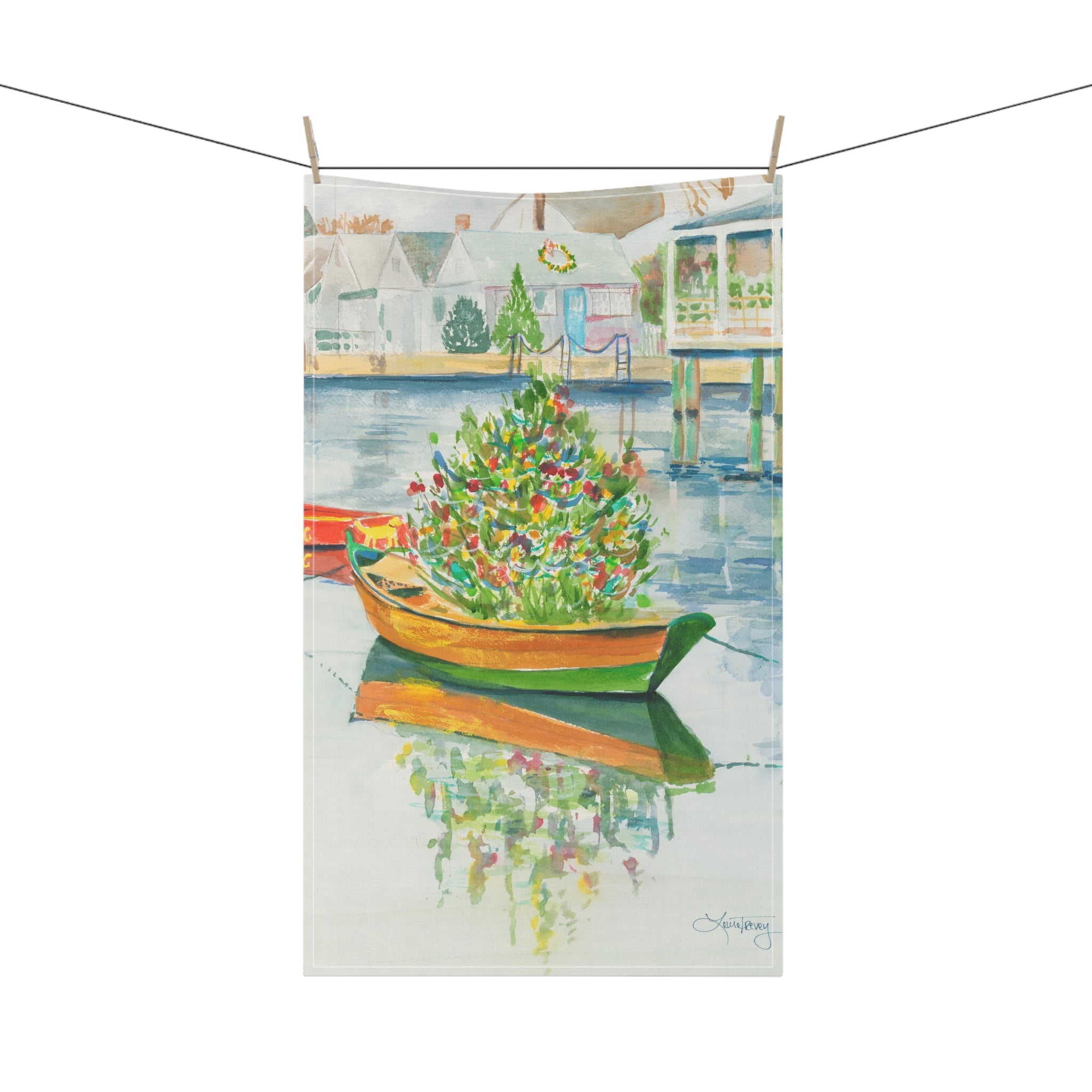Christmas on Nantucket Tea Towel by Laura Trevey, tea towel clipped to a line with clothespins