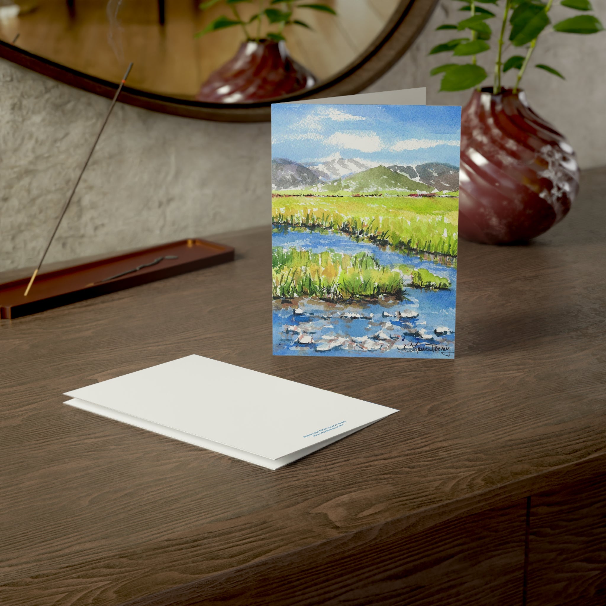 Grand Teton watercolor greeting card, on a wooden dresser with envelope