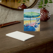 Beach Days watercolor greeting card, on a wooden dresser with envelope