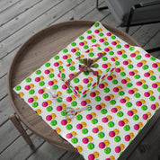Watercolor Christmas Ornament Wrapping Paper | Pink & Lime Holiday Gift Wrap Roll – full sheet with a wrapped gift and gold ribbon bow on a round wooden tray