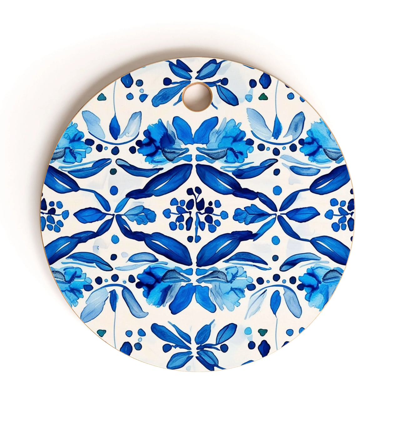 Round cutting board with blue pattern on a white background