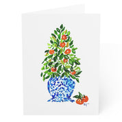 Orange tree Christmas topiary in blue and white chinoiserie pot watercolor Christmas card, front, blank inside, by Laura Trevey