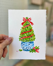 5x7 boxwood Christmas topiary watercolor held in hand for scale