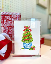 5x7 boxwood Christmas topiary original watercolor in a clear acrylic frame, framed option standing on a desk