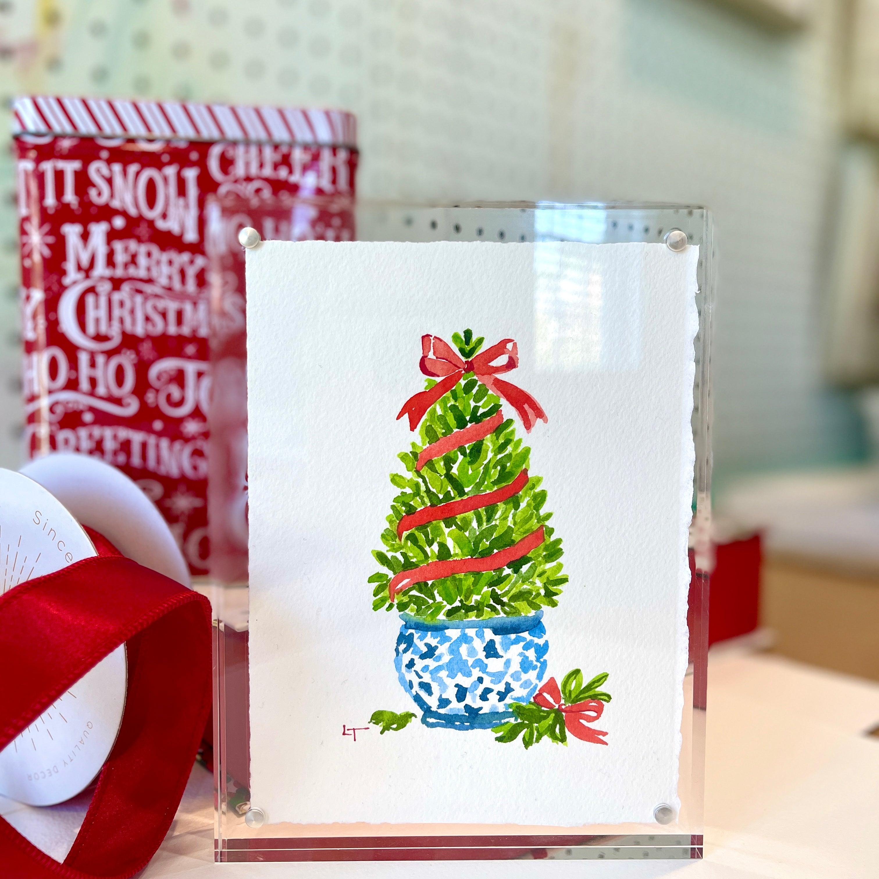 5x7 boxwood Christmas topiary original watercolor in a clear acrylic frame, framed option standing on a desk