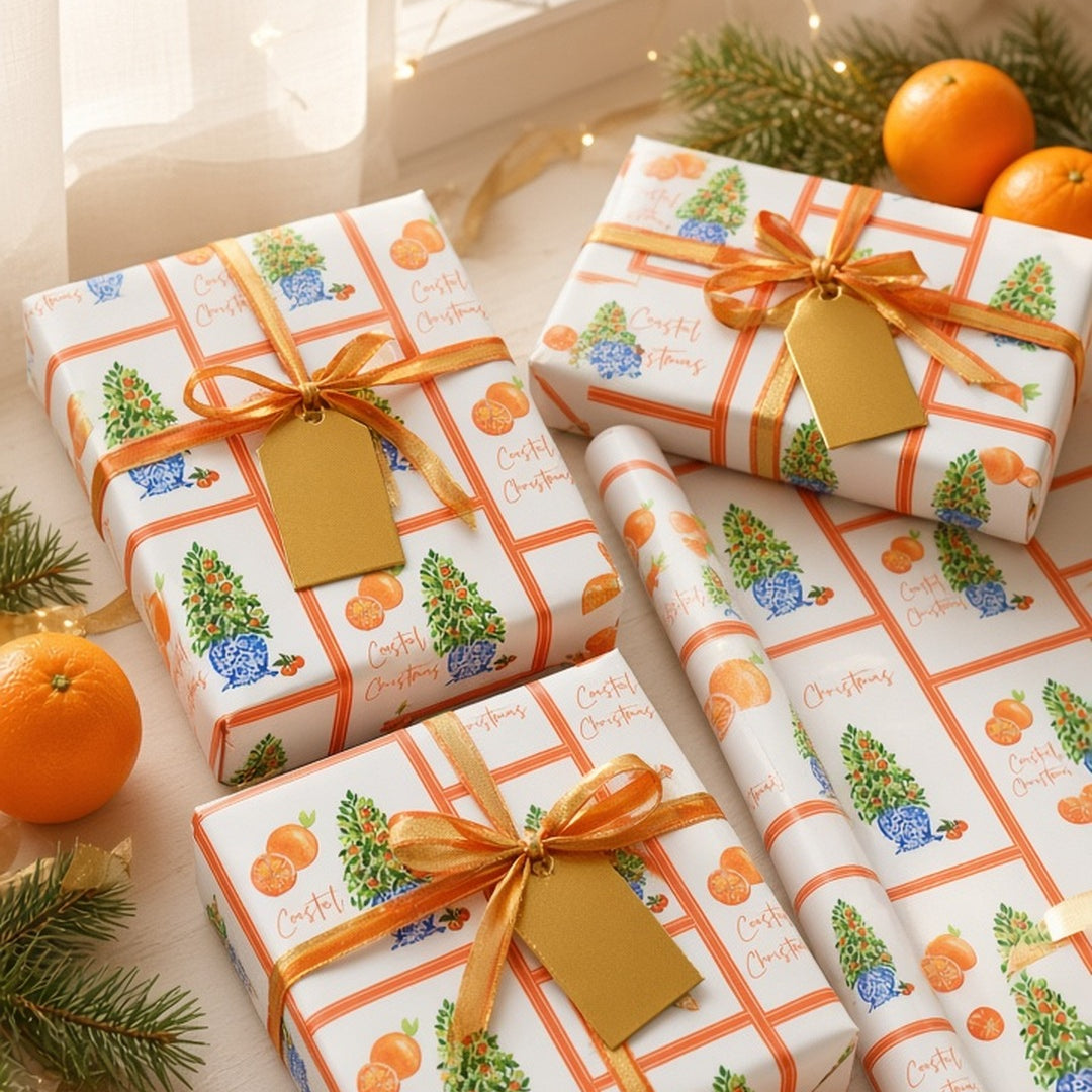 Citrus orange tree Christmas wrapping paper on gifts with orange ribbon and fresh oranges