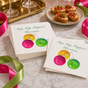 Hap Hap Happiest Christmas Cocktail Napkins | Watercolor Ornament Paper Napkins – Hap Hap Happiest Christmas cocktail napkins by Laura Trevey with pink, orange and lime watercolor ornaments on white marble with pink martinis and a bowl of ornaments