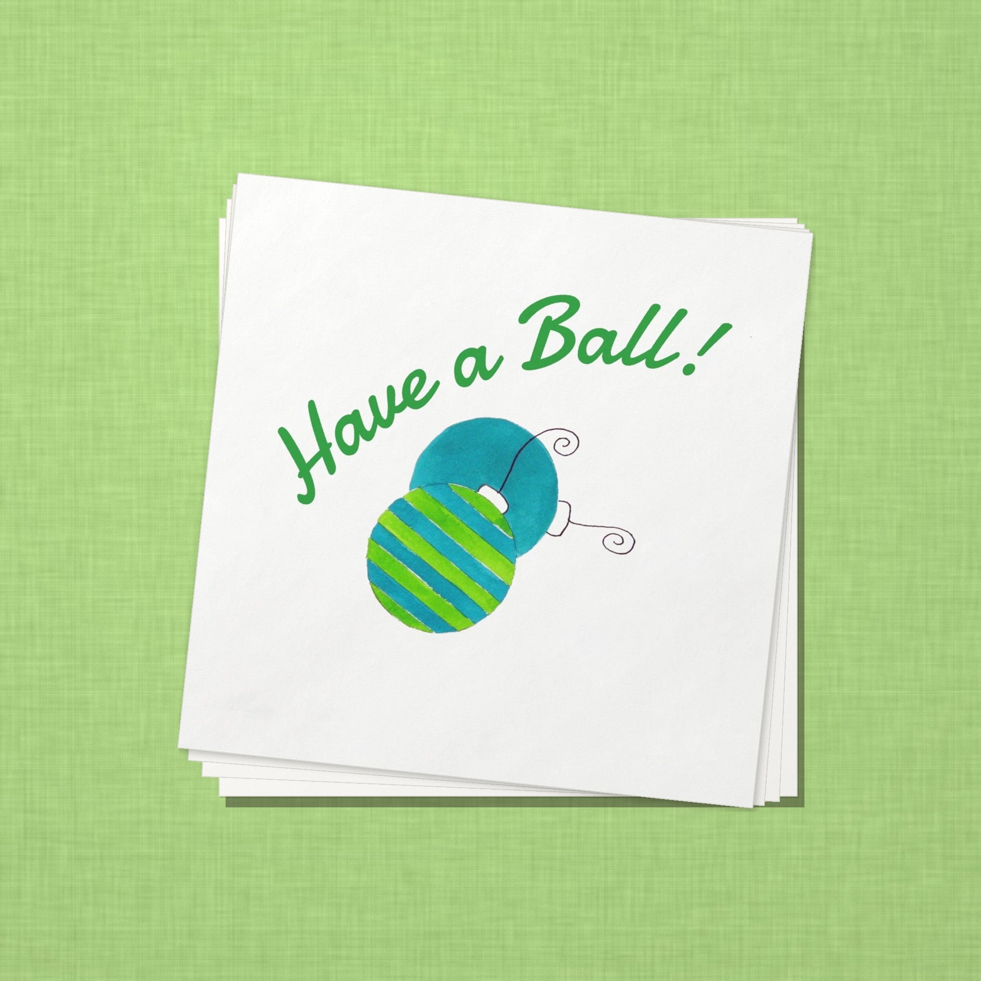 Have a Ball Christmas Cocktail Napkins | Watercolor Ornament Paper Napkins – stack of cocktail napkins on lime green linen