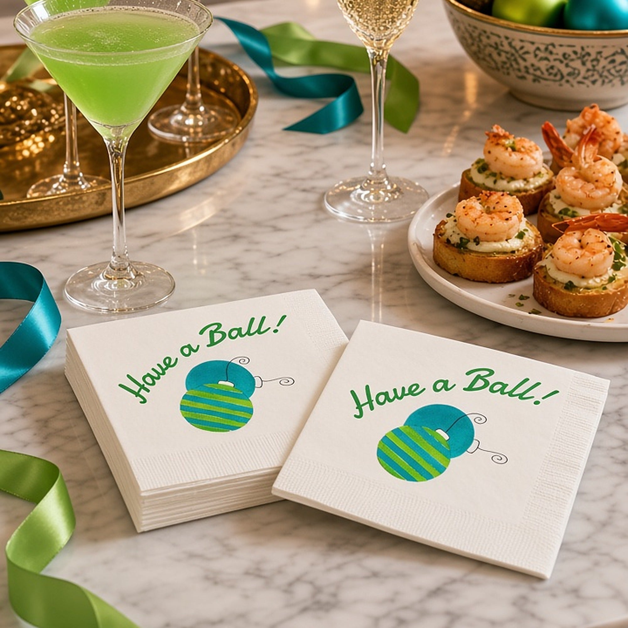 Have a Ball Christmas Cocktail Napkins | Watercolor Ornament Paper Napkins – Have a Ball Christmas cocktail napkins by Laura Trevey with teal and lime ornaments on white marble with green martinis, champagne and shrimp crostini