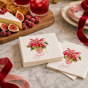 Joyful Poinsettia Christmas Cocktail Napkins | Watercolor Holiday Paper Napkins – Stacks of Joyful poinsettia watercolor napkins by Laura Trevey on white marble with a cheese board, figs, sugared cranberries and cranberry cocktails